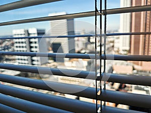 Blinds with the downtown of Atlanta in the background