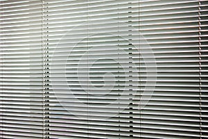 Blinds on the window. Background of the blinds. Horizontal stripes
