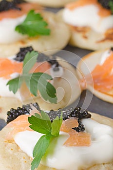 Blini with caviar and smoked salmon