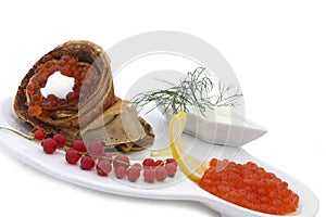 Blini with red caviar photo