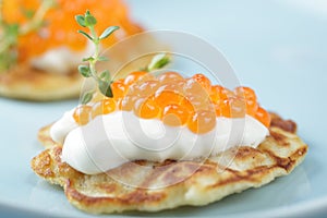 Blinis with red caviar