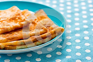 Bliny served on ceramic plate
