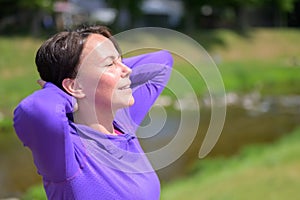 Blissful woman enjoying the spring sunshine