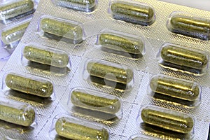Blister of capsules with herbs.