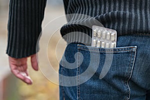 Blister of pills in back jeans pocket