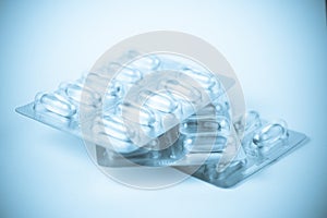 Blisters with capsules in blue light