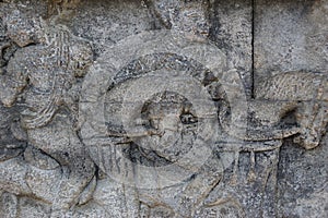 Blitar, East Java, Indonesia - April 25th, 2021 : Ancient relief on the stone of penataran temple, Blitar, East Java Indonesia