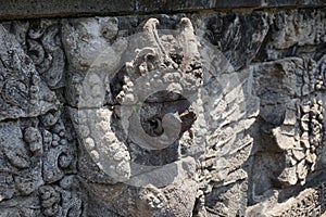 Blitar, East Java, Indonesia - April 25th, 2021 : Ancient relief on the stone of penataran temple, Blitar, East Java Indonesia