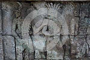 Blitar, East Java, Indonesia - April 25th, 2021 : Ancient relief on the stone of penataran temple, Blitar, East Java Indonesia