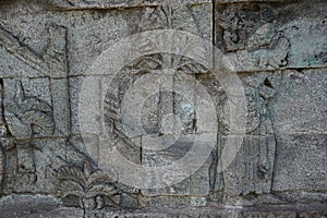 Blitar, East Java, Indonesia - April 25th, 2021 : Ancient relief on the stone of penataran temple, Blitar, East Java Indonesia