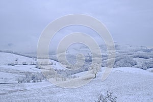 Blizzard in the mountains. Snowy hills, mountains, nature, horizon. Natural background. Appennino-Tosco-emiliano photo