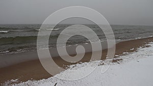 Blizzard and the running waves on the sandy snow coast of a reservoir, Ob River , Siberia