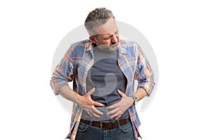 Bloated man touching abdomen photo