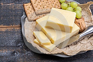 Block of aged cheddar cheese, the most popular type of cheese in