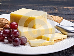 Block of aged cheddar cheese, the most popular type of cheese in