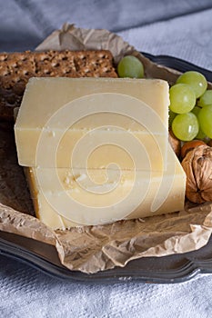 Block of aged cheddar cheese, the most popular type of cheese in