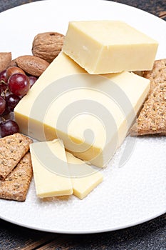 Block of aged cheddar cheese, the most popular type of cheese in