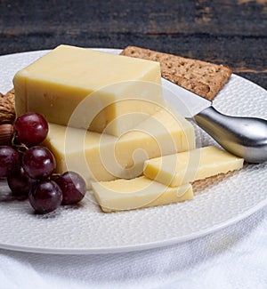 Block of aged cheddar cheese, the most popular type of cheese in