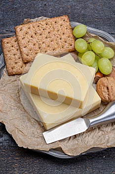 Block of aged cheddar cheese, the most popular type of cheese in