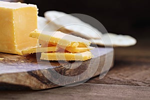 Block of Cheddar Cheese with Slices