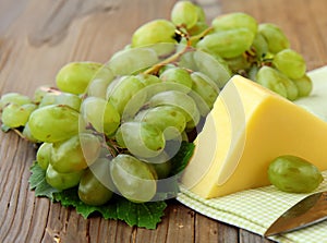 block cheese and fresh grapes