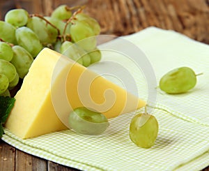 block cheese and fresh grapes