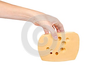 Block of cheese in hand isolated on white background