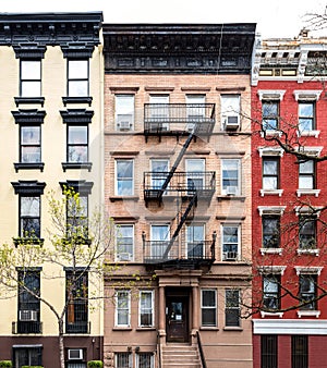 Block of colorful old apartment buildings on 10th Street in the East Village neighborhood of New York City photo