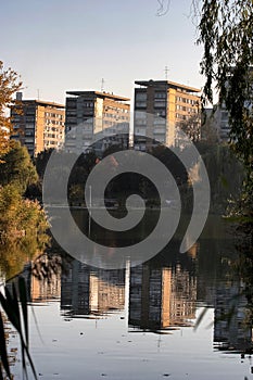 Block of flats with reflection in Titan lake