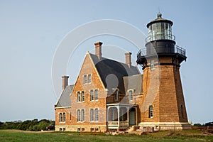 A landscape view of Block Island Southeast Light,  a lighthouse located on