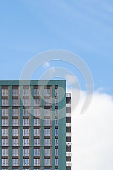Block of modern apartments with a blue sky background