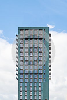 Block of modern apartments with a blue sky background