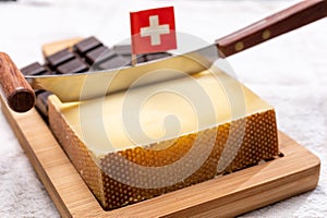 Block of Swiss medium-hard matured cheese gruyere used for baking, quiche, fondue, sandwiches