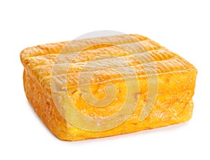 Block of tasty munster cheese isolated
