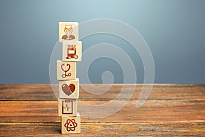 Block tower with medical icons symbols. Healthcare and medical Insurance concept. Supplies, equipment and specialists