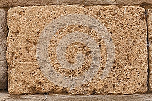 Block of tuff on wall of medieval palace