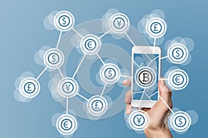 Blockchain and bitcoin technology and mobile computing concept on blue background