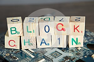 Blockchain concept. Wood blocks say block chain with binary code