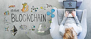 Blockchain with man using a laptop