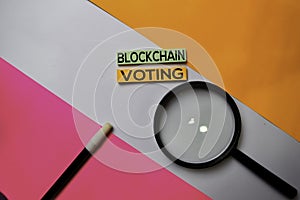 Blockchain Voting text on sticky notes with color office desk concept