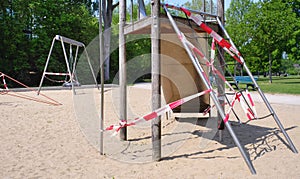 Blocked, closed public children`s playground due to coronavirus lockdown, good copy space