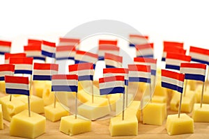 Blocks of Dutch cheese on a wooden tray