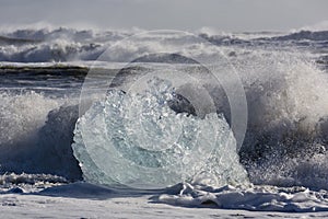 Blocks of ice from the glaciers break up and is washed ashore by