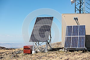 Blocks of solar panels to provide power for a cellular tower at a remote location