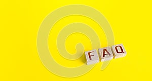 Blocks with the word abbreviation FAQ frequently asked questions on a yellow background. Answers explanations for users
