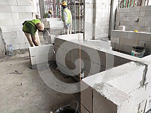 Blockwork by construction workers at the construction site.