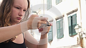 Blog close-up shots young teenage girl is filming a video with concentration Holds the camera down while filming food