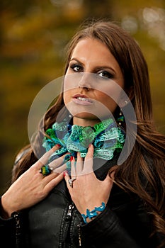 Blog style pretty young woman on a walk in forest on late autumn