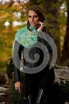 Blog style pretty young woman on a walk in forest on late autumn