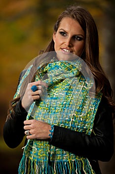 Blog style pretty young woman on a walk in forest on late autumn